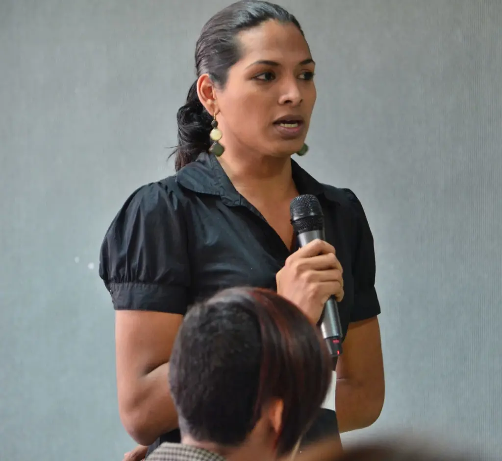 Rihanna Ferrera holds a microphone