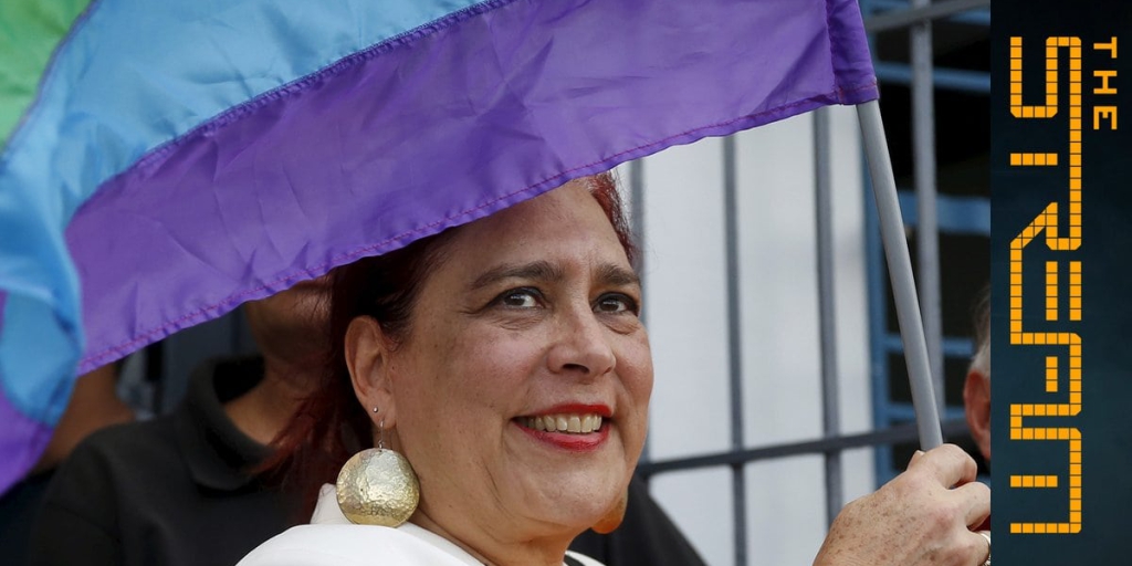 Venezuelan National Assembly Member Tamara Adrian holding a Pride Flag