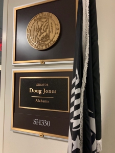 A photo of the plaque outside Senator Doug Jones Office 